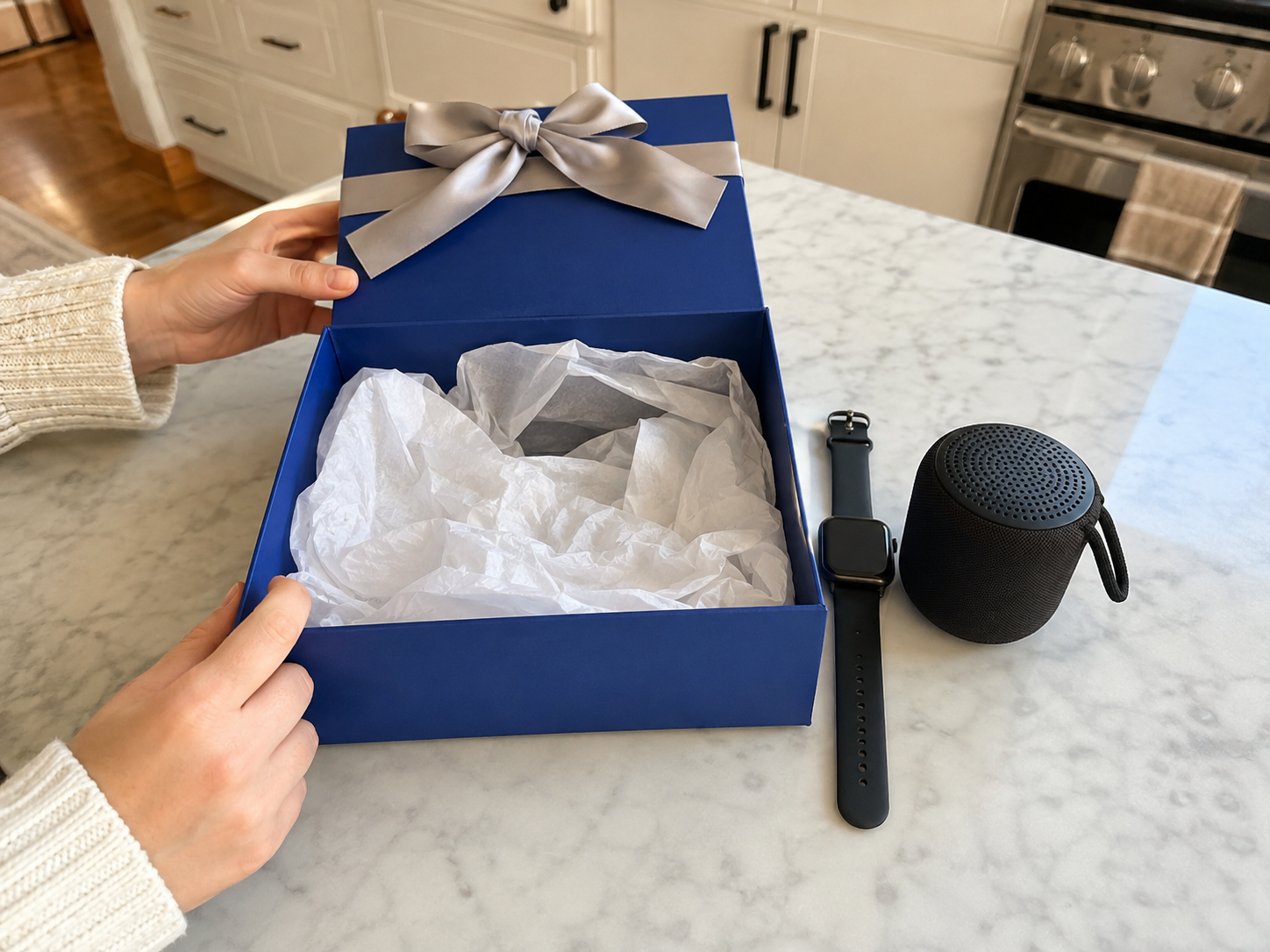 Illustrative blue box unboxing with smartwatch and speaker